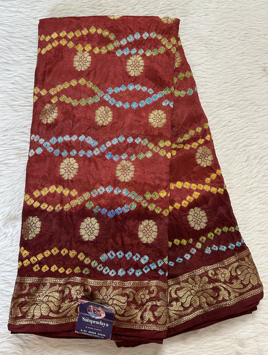 Bandhani Saree Maroon Colored Complemented with a Zari Border. - Sampradaya Designer Studio