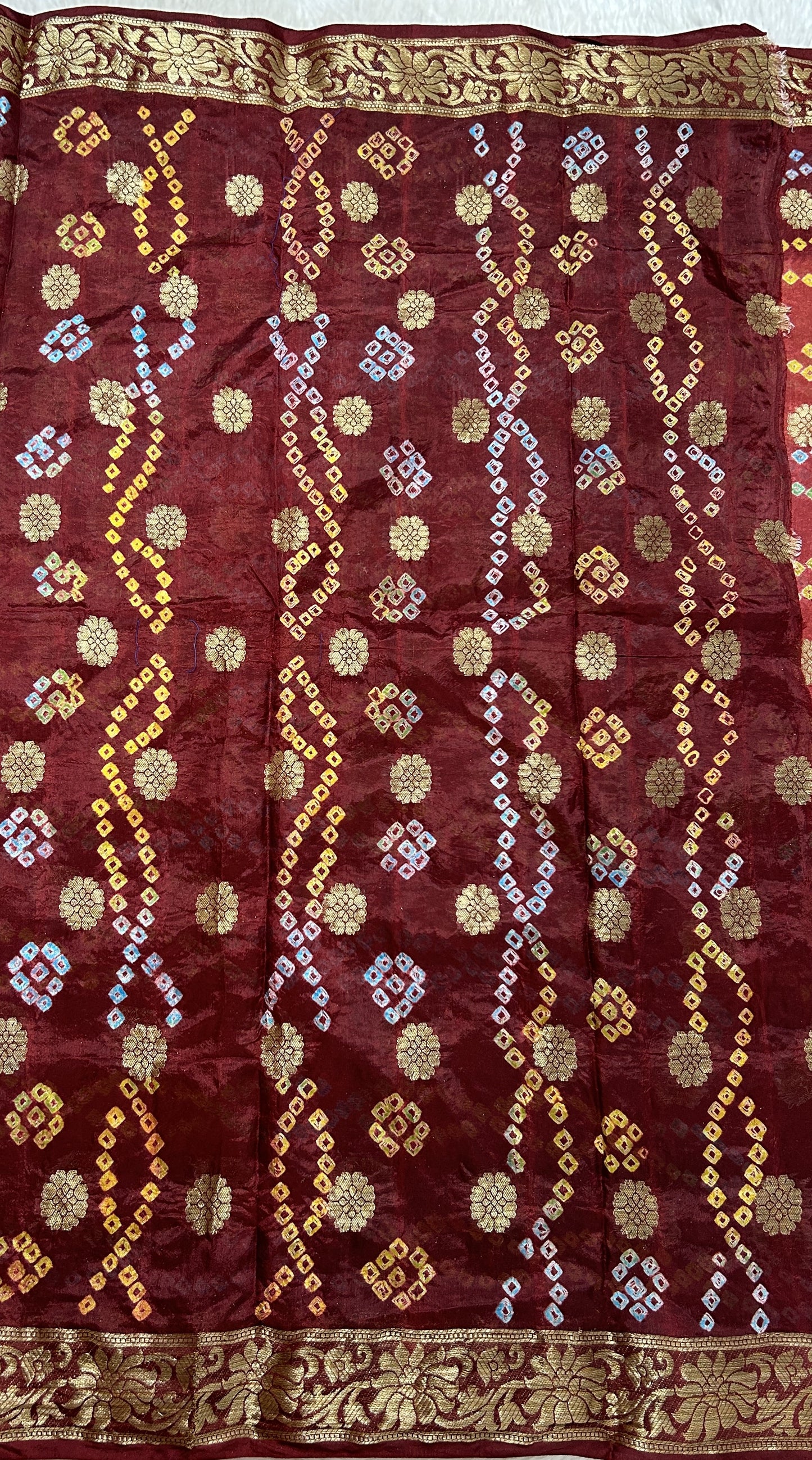 Bandhani Saree Maroon Colored Complemented with a Zari Border. - Sampradaya Designer Studio