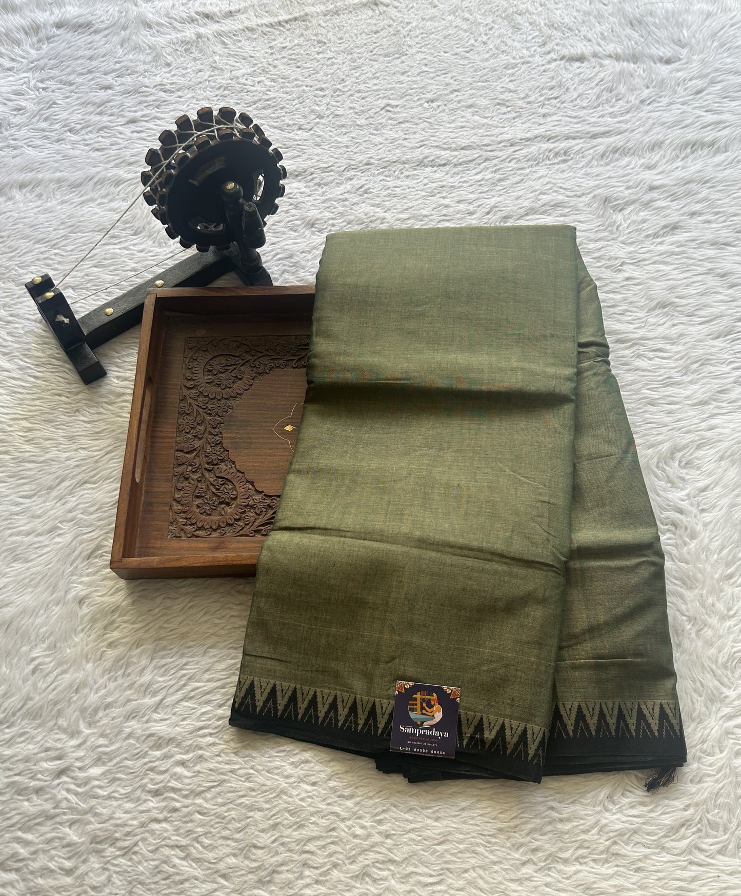 Narayanpet Cotton Saree Olive Green Colored Complemented with a Black Thread Border.