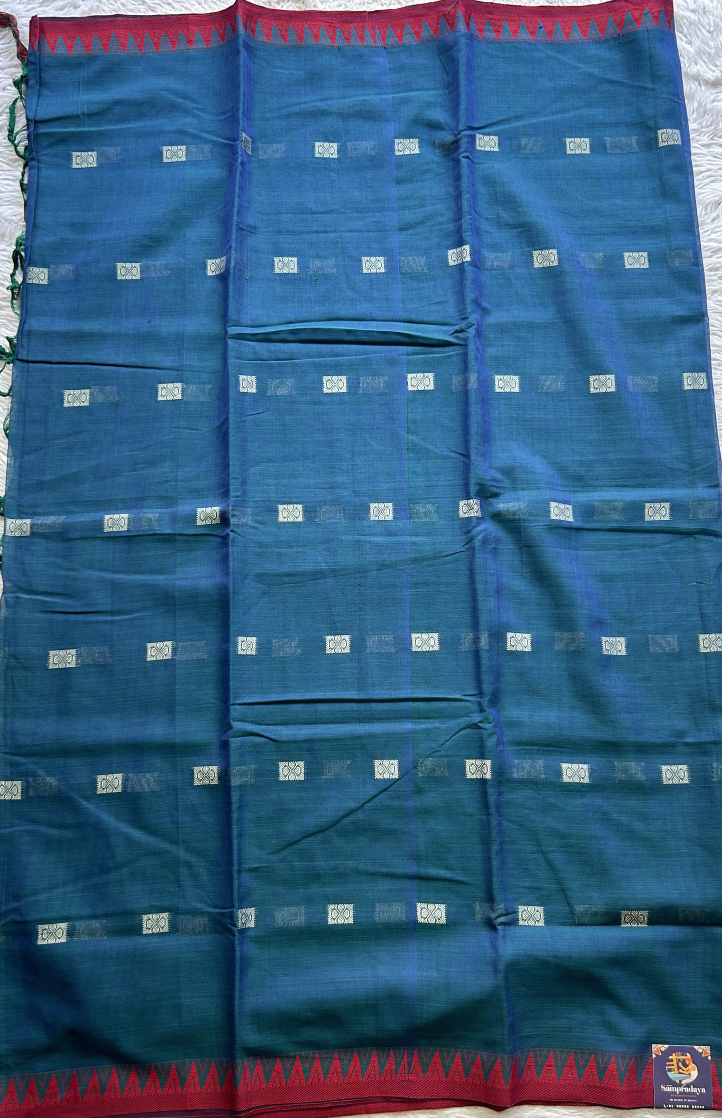 Narayanpet Cotton Buti Saree Peacock Blue Colored Complemented with a Thread Border.