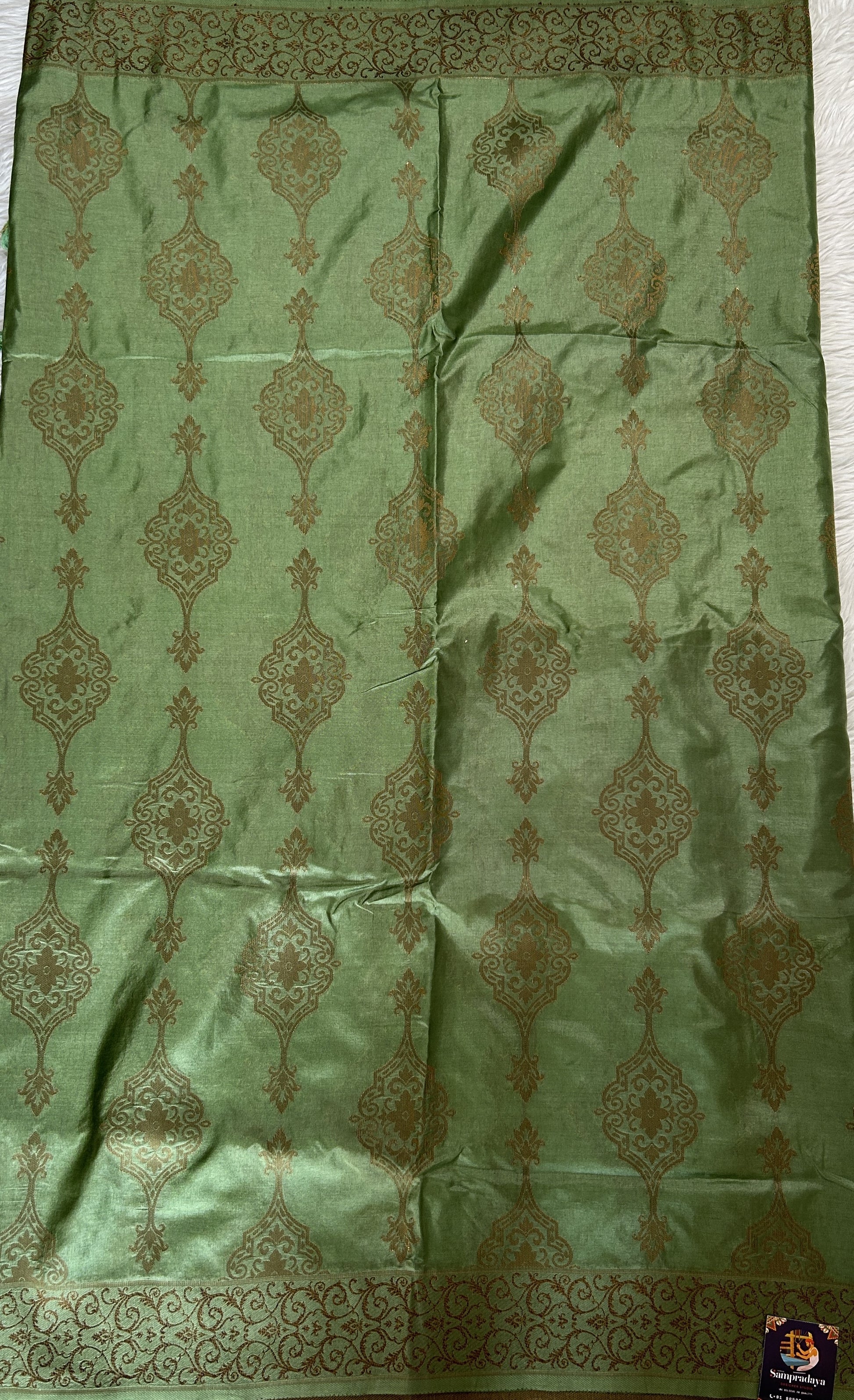 Semi Raw Silk Saree Light Green Colored Complemented with a Zari Border. - Sampradaya Designer Studio