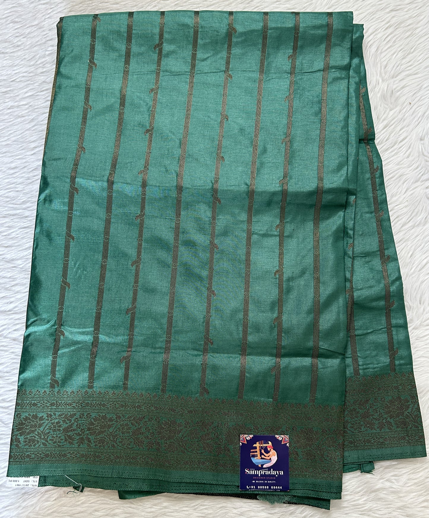 Semi Raw Silk Saree Castleton Green Colored Complemented with a Zari Border. - Sampradaya Designer Studio