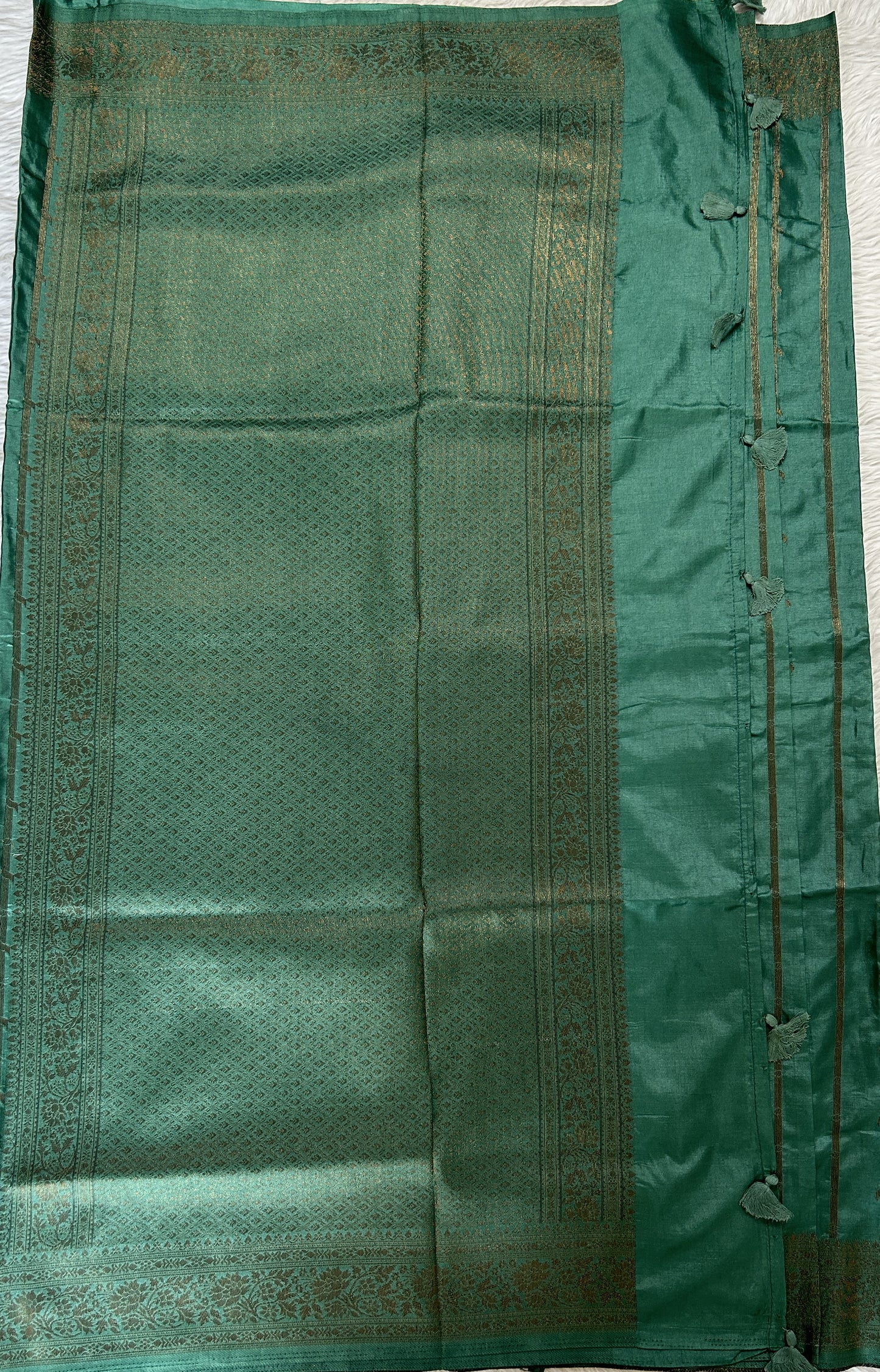 Semi Raw Silk Saree Castleton Green Colored Complemented with a Zari Border. - Sampradaya Designer Studio