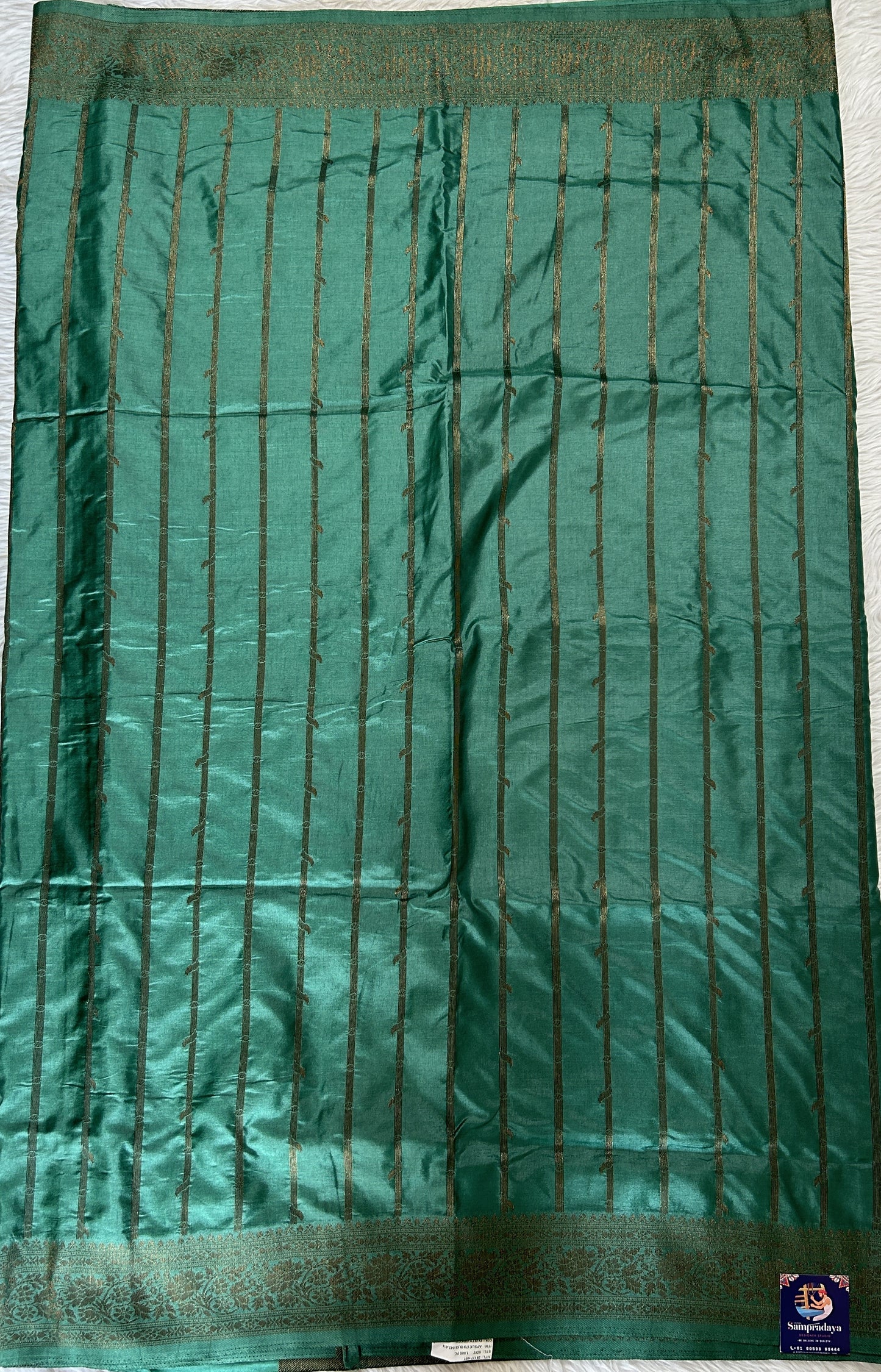 Semi Raw Silk Saree Castleton Green Colored Complemented with a Zari Border. - Sampradaya Designer Studio