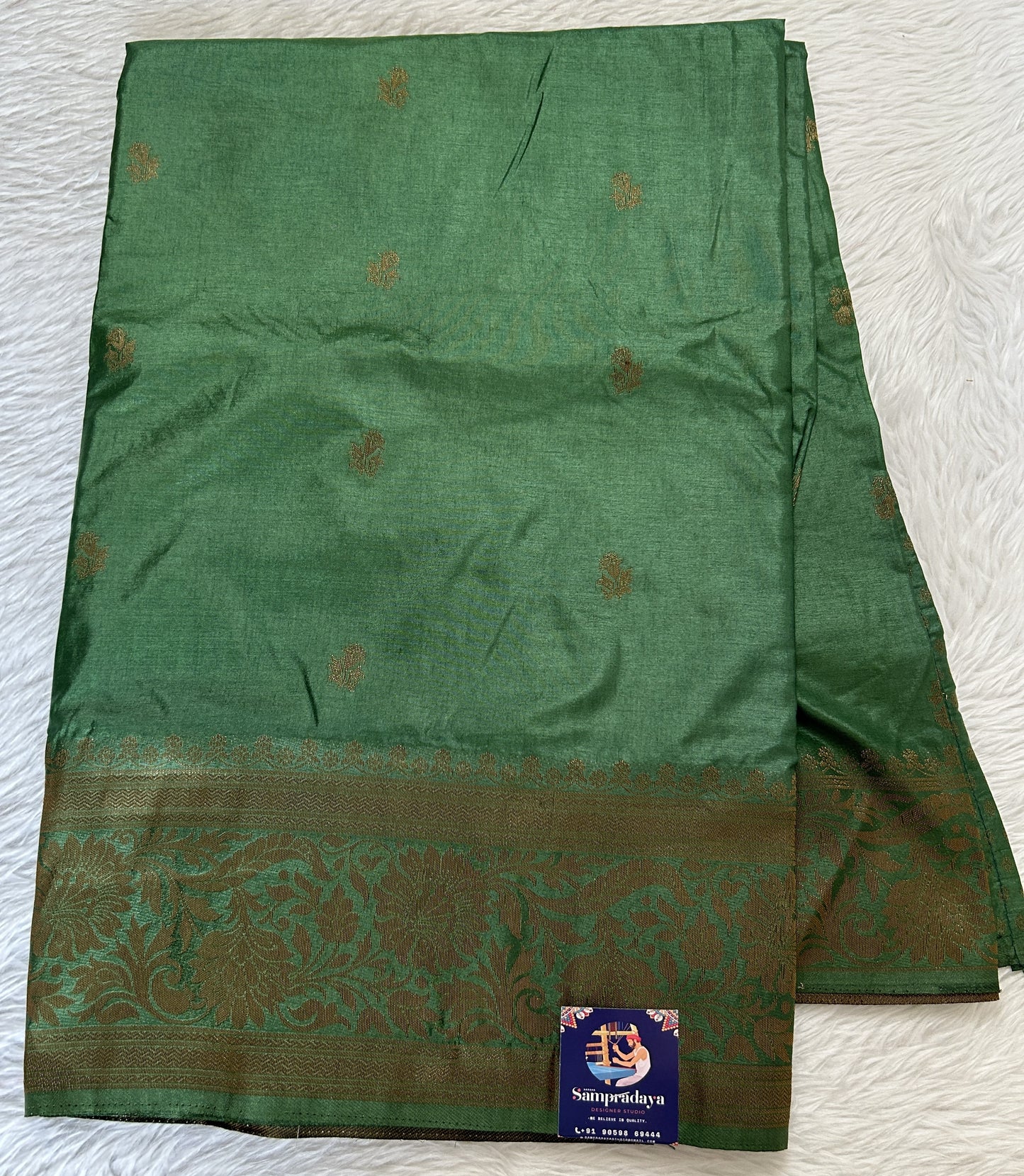 Semi Raw Silk Saree Bottle Green Colored Complemented with a Zari Border. - Sampradaya Designer Studio