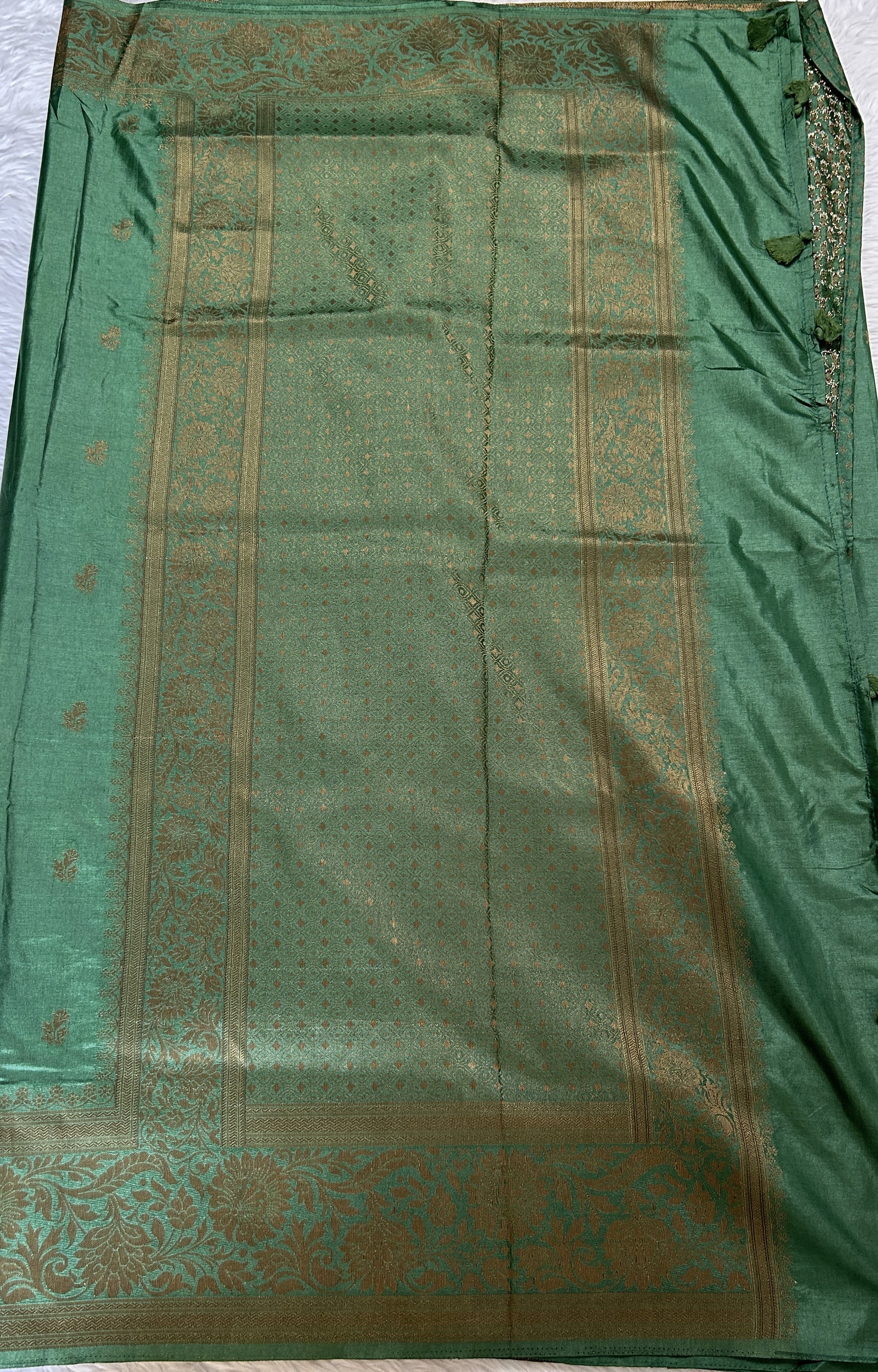 Semi Raw Silk Saree Bottle Green Colored Complemented with a Zari Border. - Sampradaya Designer Studio