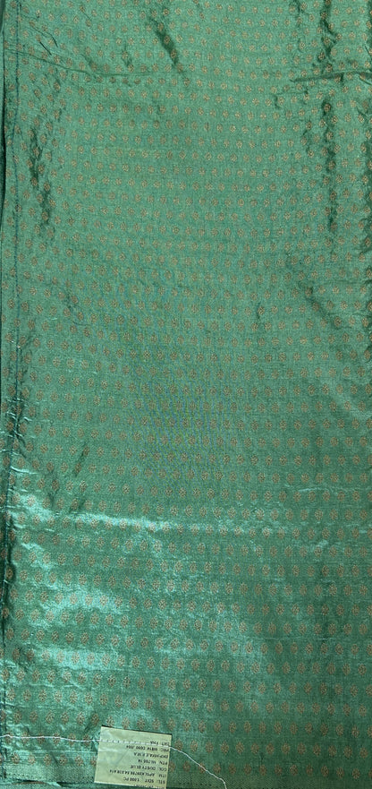 Semi Raw Silk Saree Bottle Green Colored Complemented with a Zari Border. - Sampradaya Designer Studio