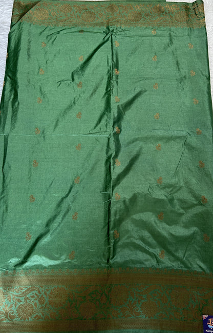 Semi Raw Silk Saree Bottle Green Colored Complemented with a Zari Border. - Sampradaya Designer Studio