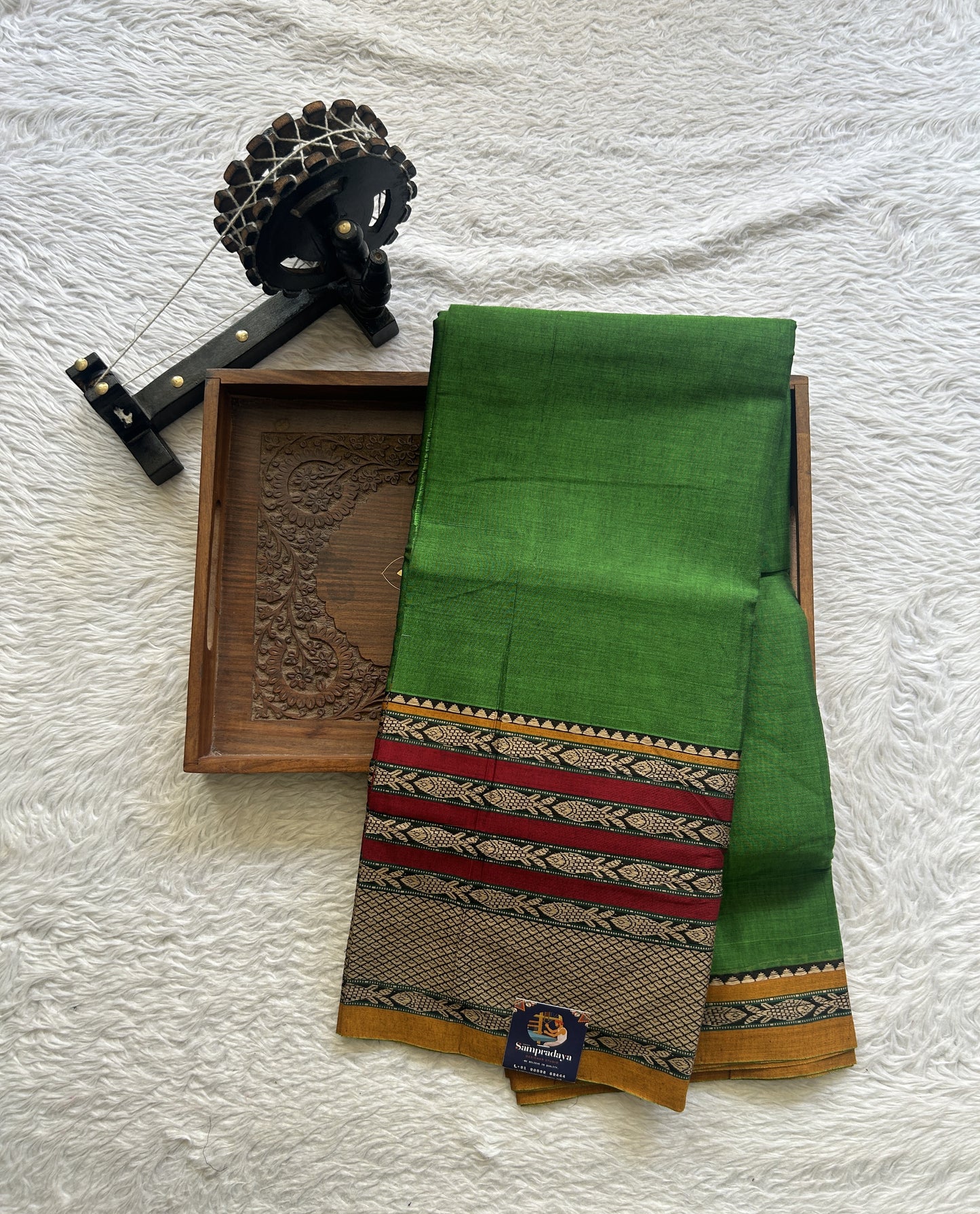 Narayanpet Cotton Saree Leaf Green Colored Complemented with a Minakari Thread Border.