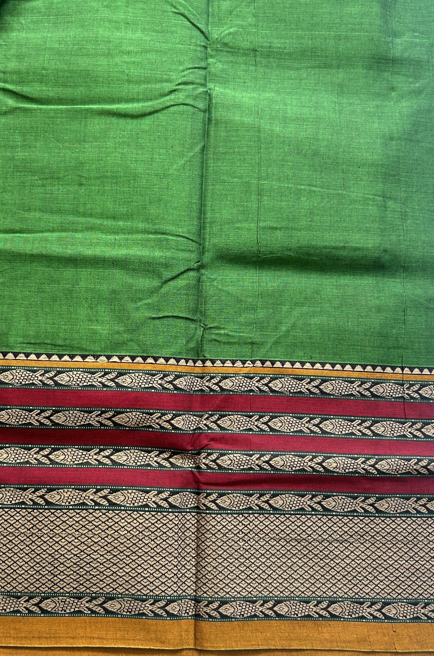 Narayanpet Cotton Saree Leaf Green Colored Complemented with a Minakari Thread Border.