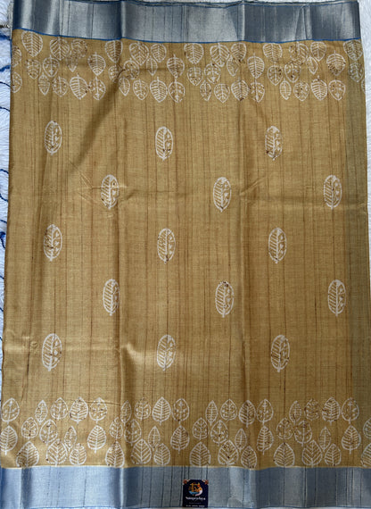 Semi Tussar Saree Wheat Color Complemented with a Blue Zari Border. - Sampradaya Designer Studio