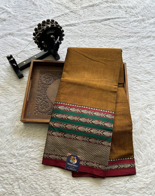 Narayanpet Cotton Saree Copper Colored Complemented with a Double Thread Border.