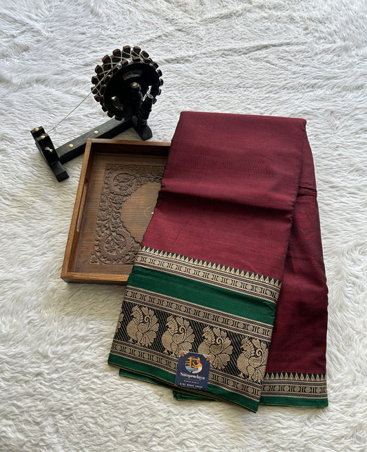 Narayanpet Cotton Saree Maroon Colored Complemented with a Peacock Border.