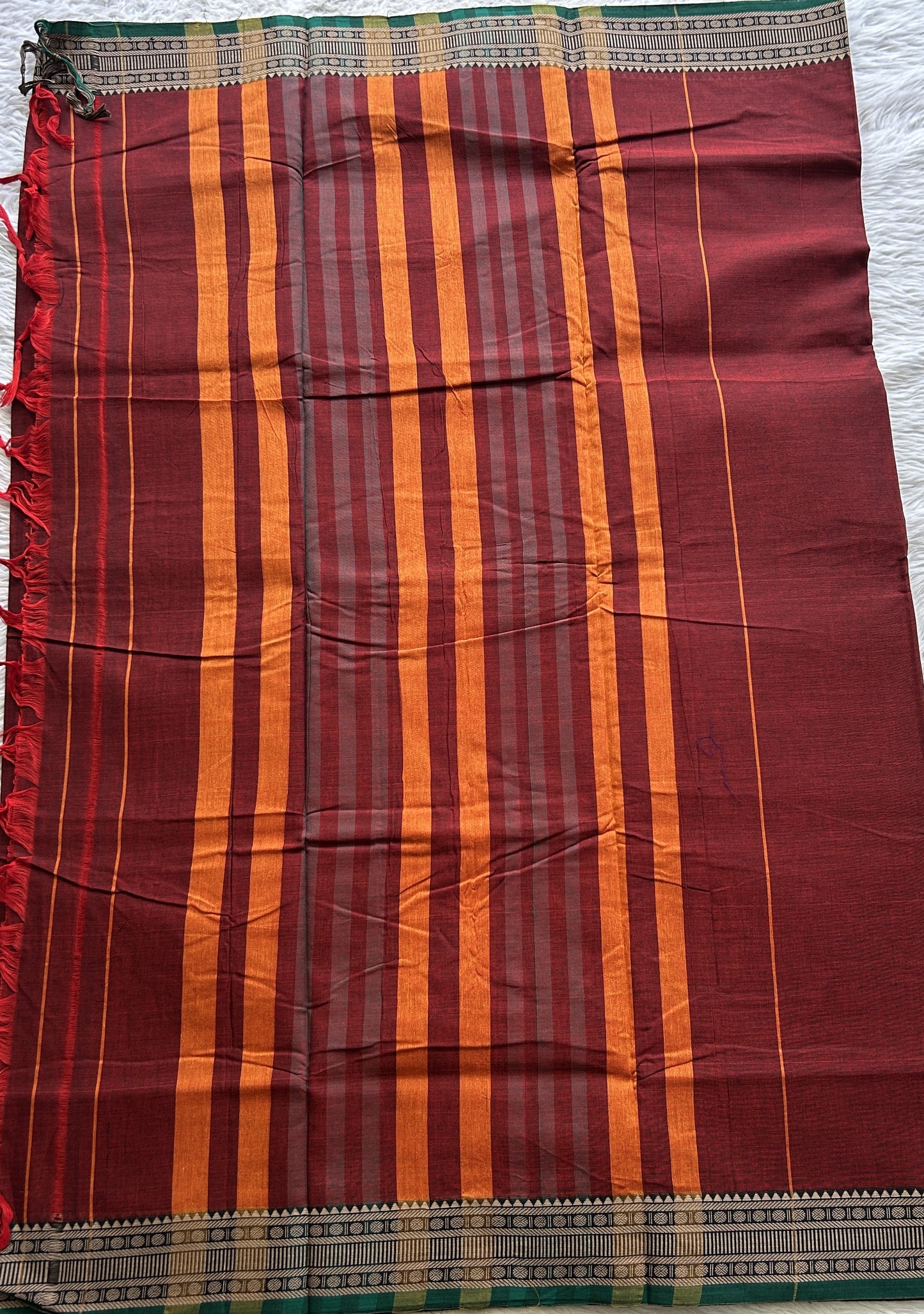 Narayanpet Cotton Saree Garnet Colored Complemented with a Thread Border.