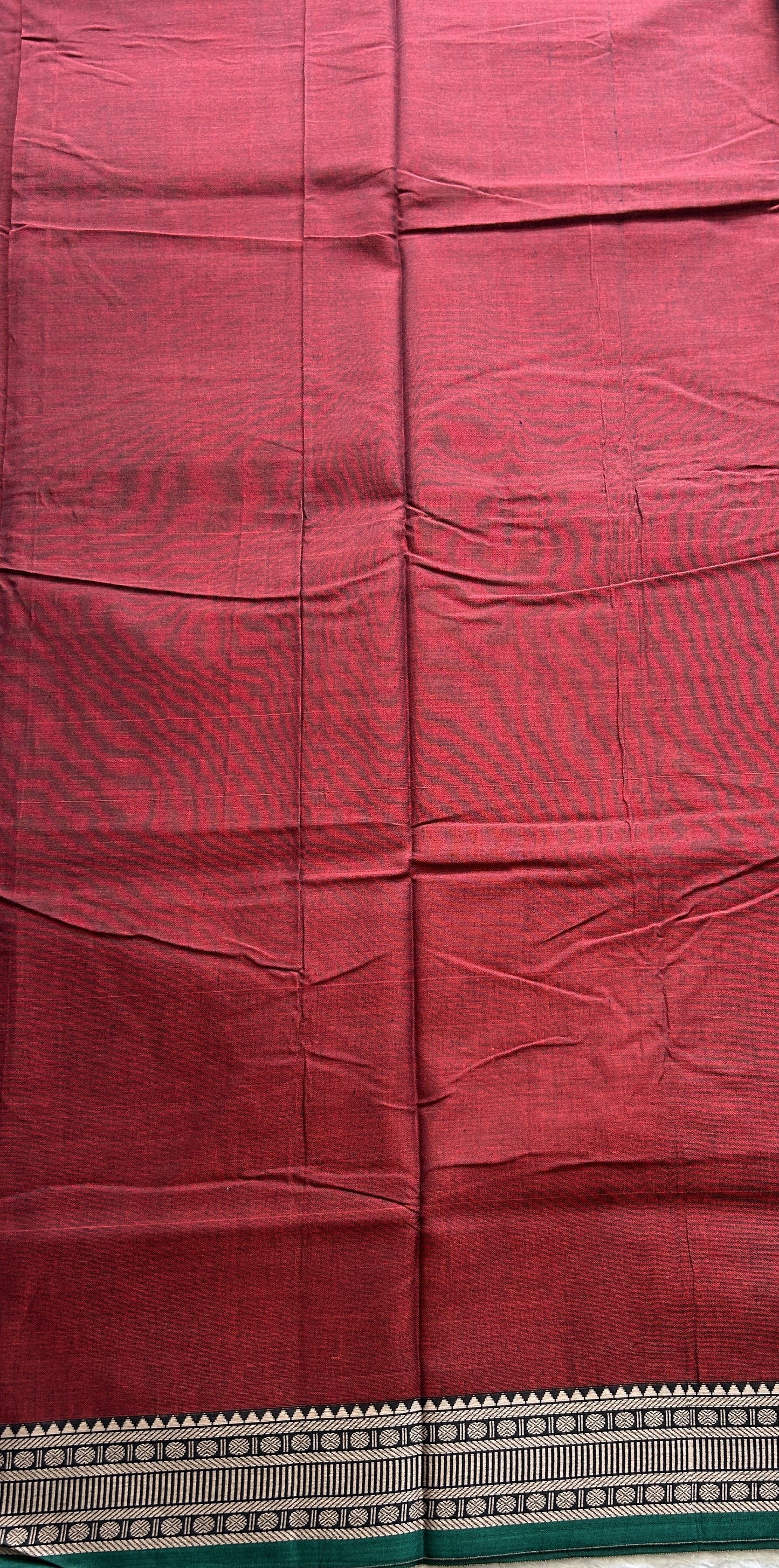 Narayanpet Cotton Saree Garnet Colored Complemented with a Thread Border.