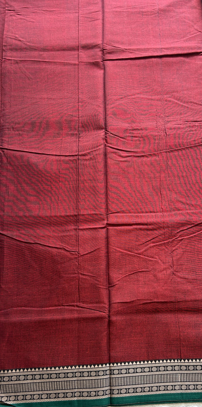 Narayanpet Cotton Saree Garnet Colored Complemented with a Thread Border.