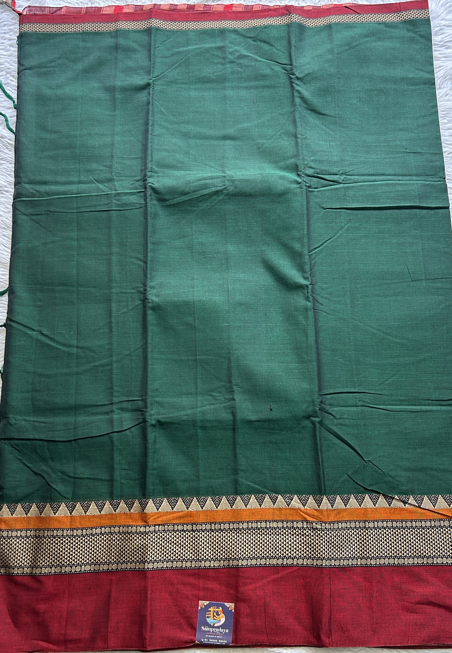 Narayanpet Cotton Saree Dark Green Colored Complemented with a Double Border.