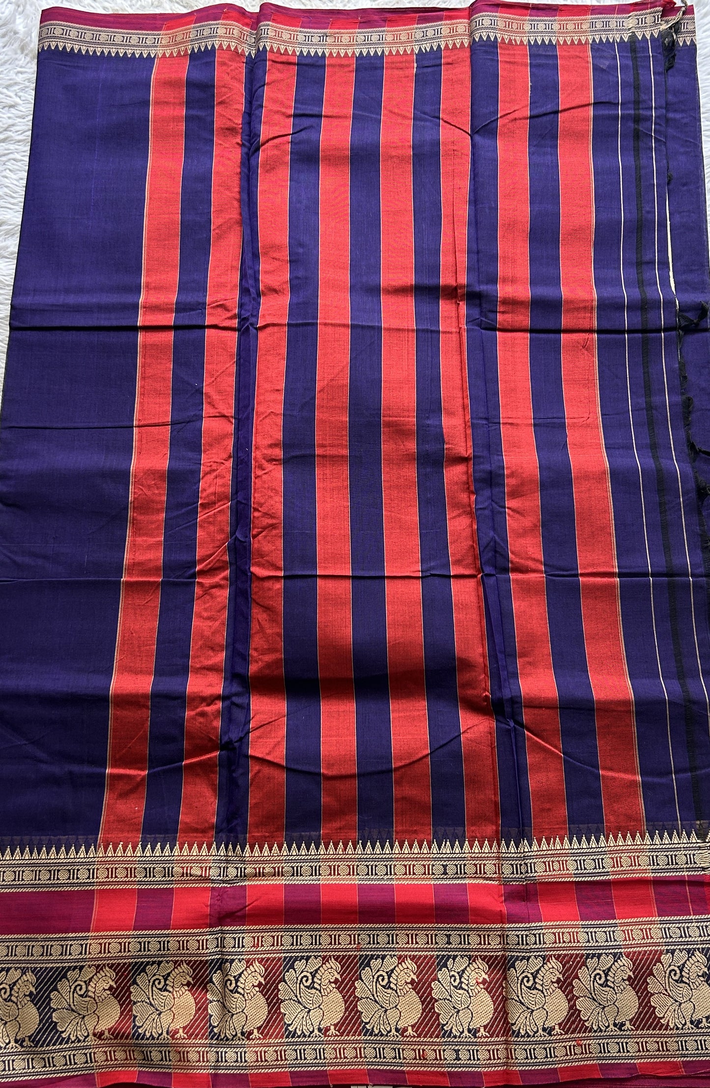 Narayanpet Cotton Saree Violet Colored Complemented with a Peacock Border.