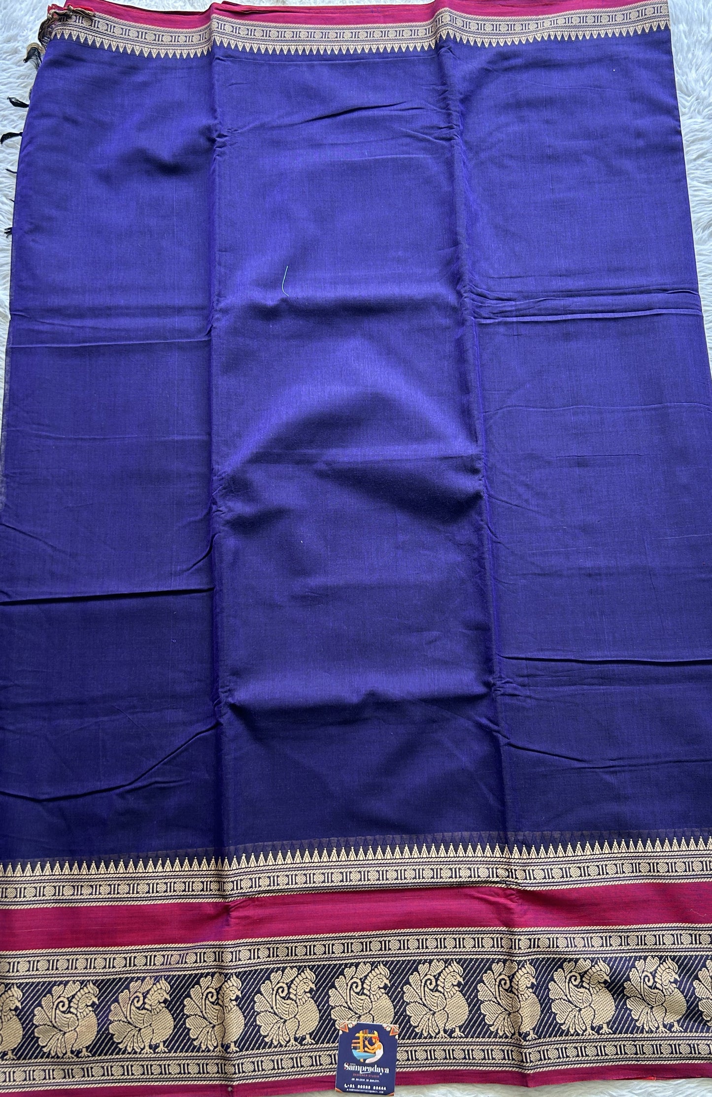 Narayanpet Cotton Saree Violet Colored Complemented with a Peacock Border.