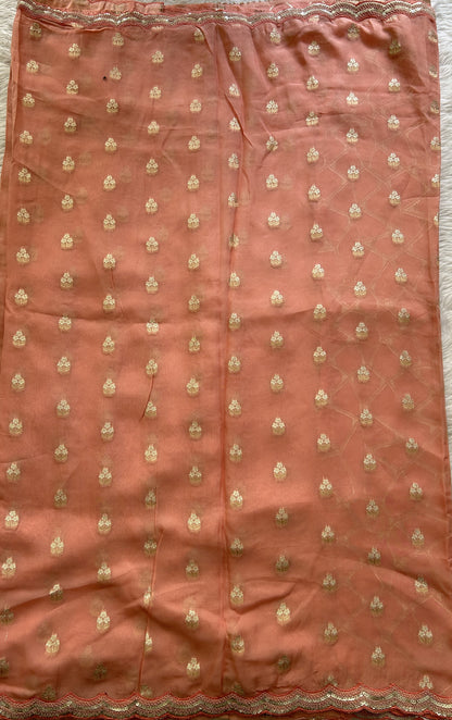 Banarasi Georgette Saree Peach Colored Complemented with a Lace border. - Sampradaya Designer Studio