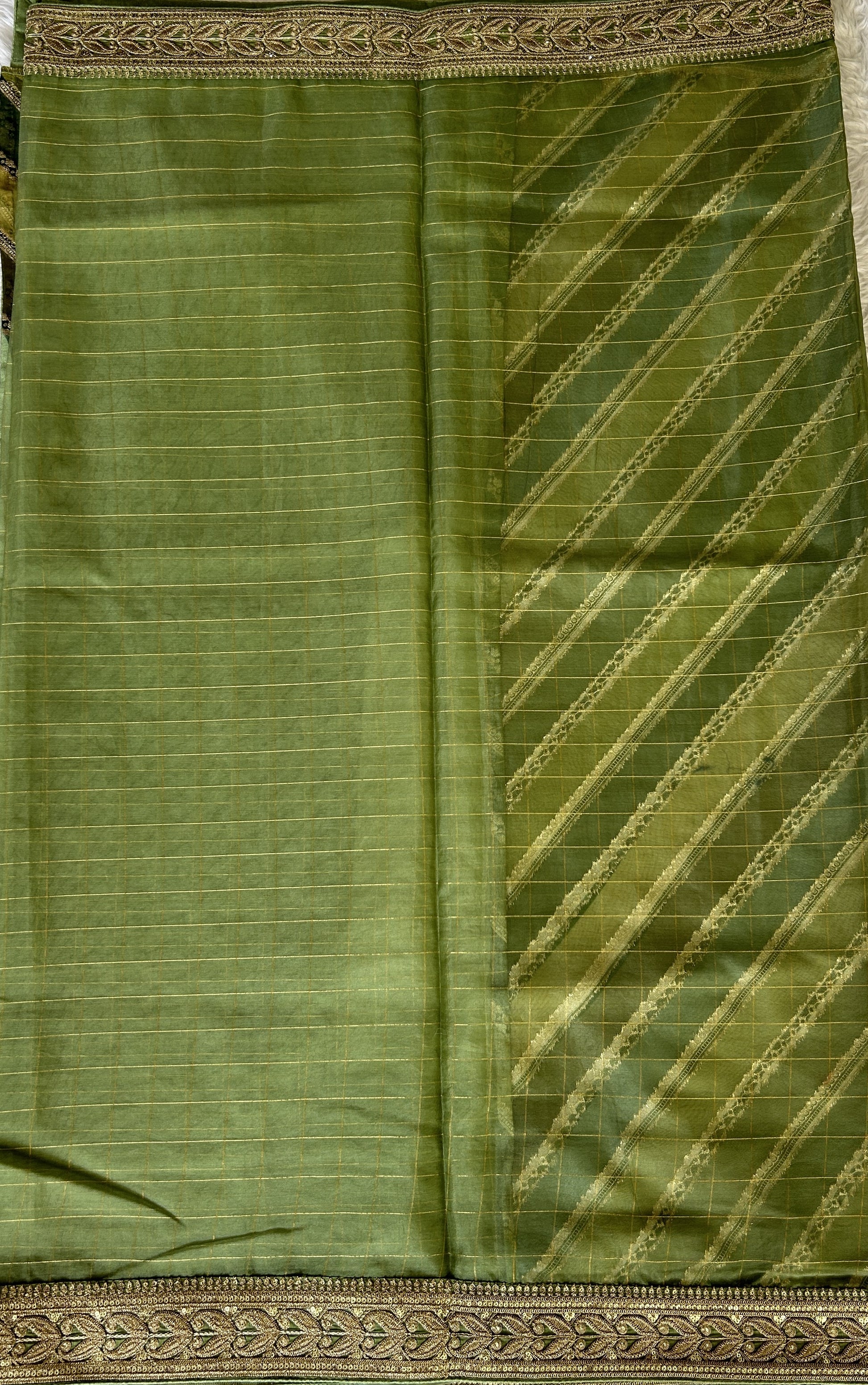 Organza Saree Party Wear Green colored complemented with a Lace border. - Sampradaya Designer Studio