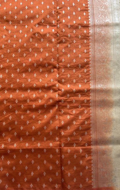 Semi Raw Silk Saree Beige Colored Complemented with a Zari Border.