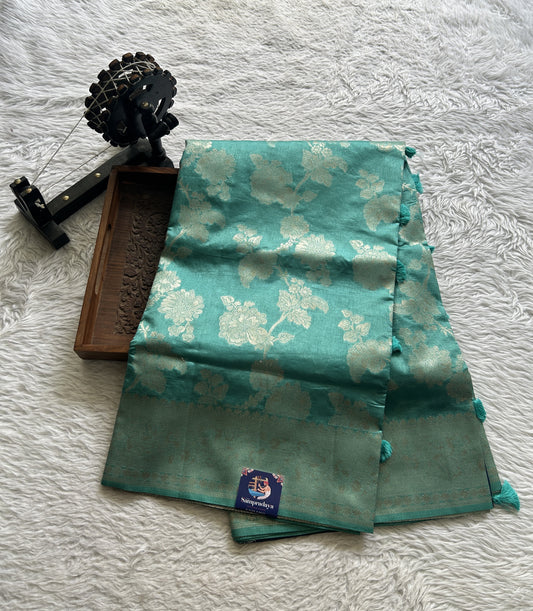 Semi Raw Silk Saree Dusty Blue Colored Complemented with a Zari Border.