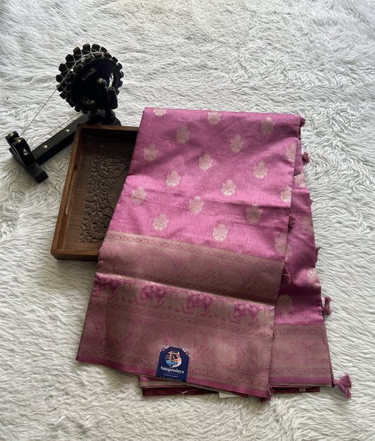 Semi Raw Silk Saree Dusty Rose Pink Colored Complemented with a Zari Border.