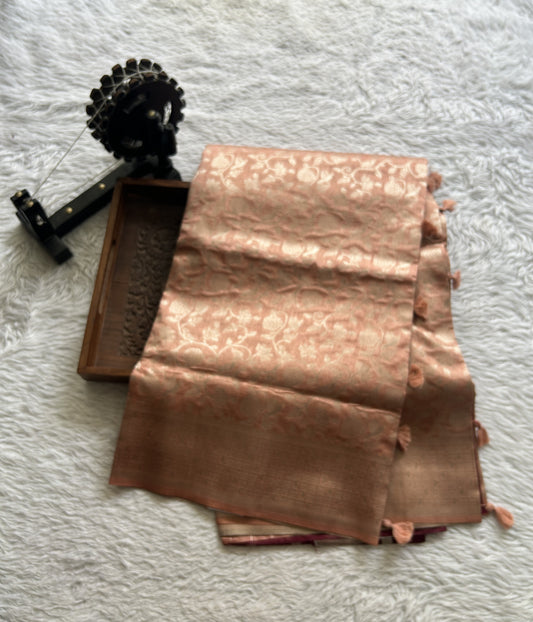 Semi Raw Silk Allover Saree Dusty Peach Colored Complemented with a Zari Border.