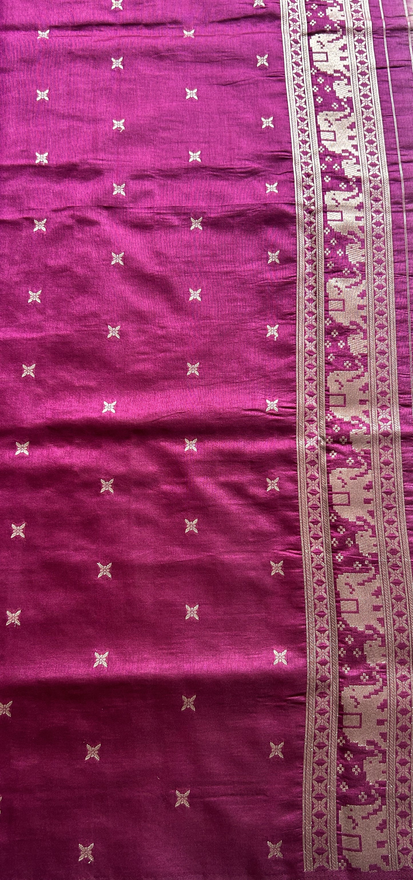 Semi Raw Silk Saree Ash Colored Complemented with a Zari Border.