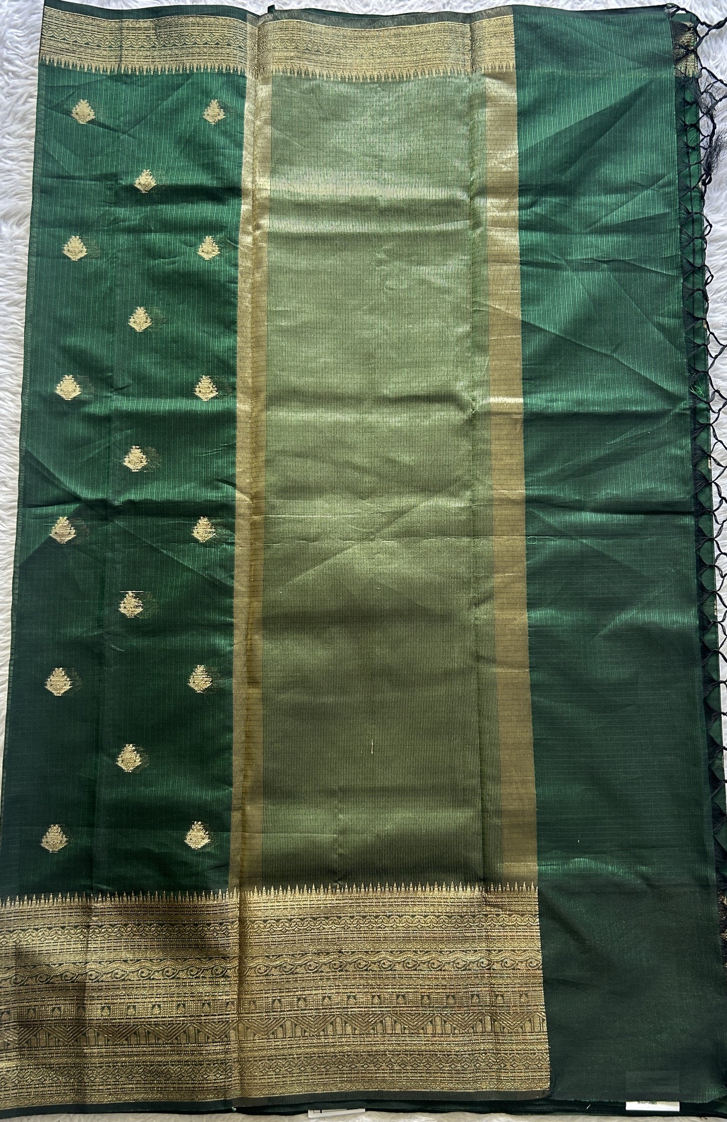 Silk kota Saree Dark Green colored Complemented with a Zari Border.