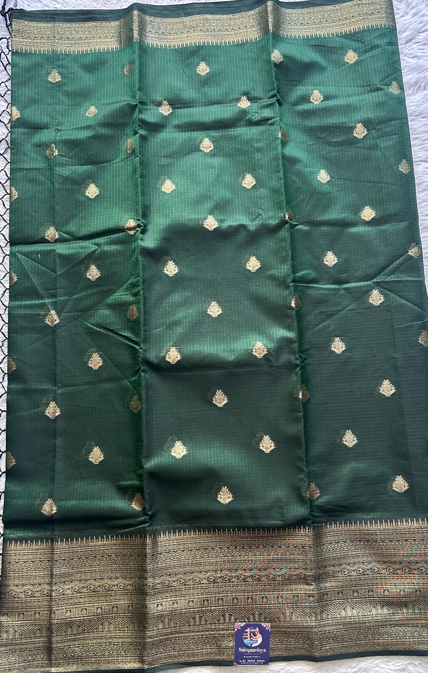 Silk kota Saree Dark Green colored Complemented with a Zari Border.