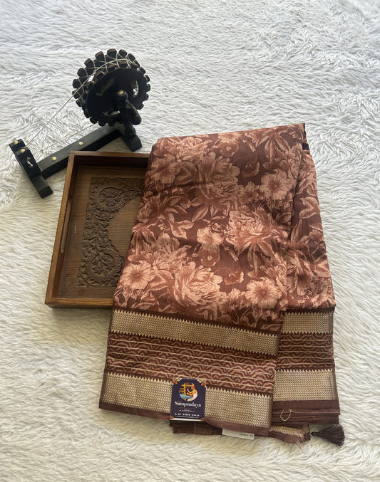 Dola Crepe Saree Dull Brown Colored Complemented with a Zari Border.