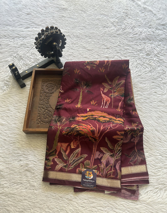 Dola Crepe Saree Wine Colored Complemented with a Zari Border.