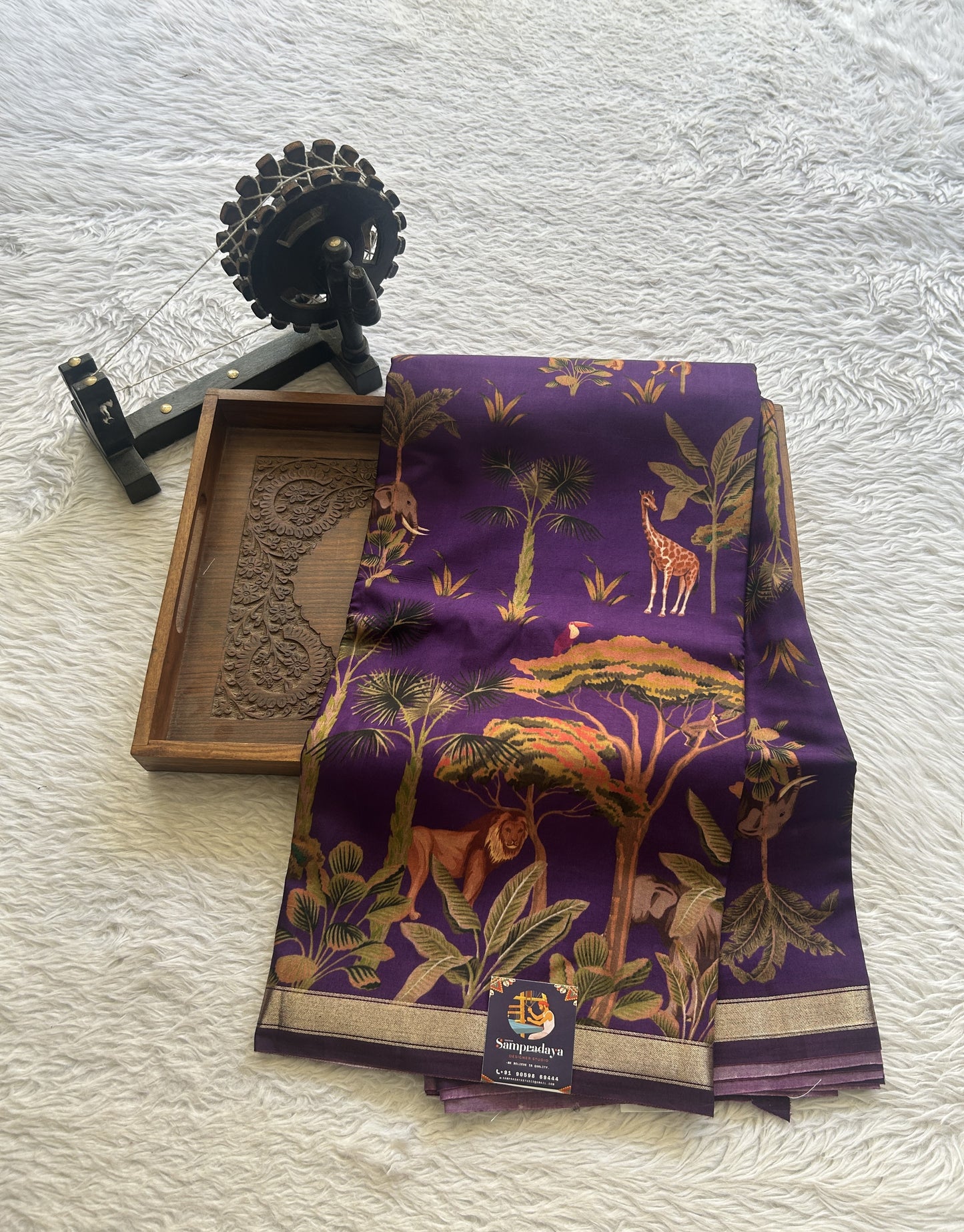 Dola Crepe Saree Violet Colored Complemented with a Zari Border.