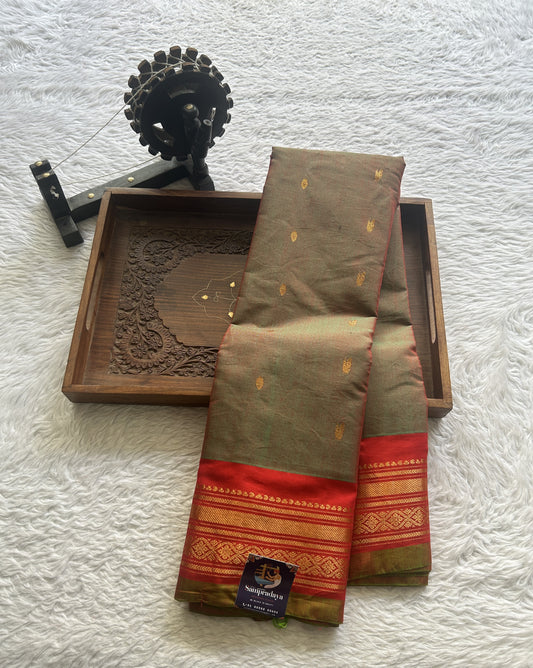 Gadwal Sico Saree Olive Green colored complemented with a Red Zari Border.