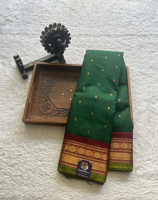 Gadwal Sico Saree Dark Green colored complemented with a Maroon Zari Border.