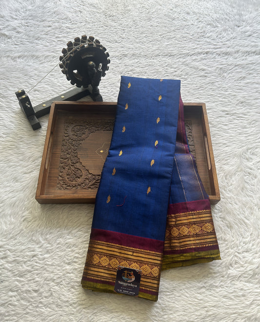 Gadwal Sico Saree Ink Blue colored complemented with a Purple Zari Border.