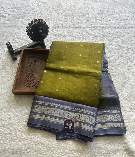 Gadwal Sico Saree Green colored complemented with a Lilac Zari Border.