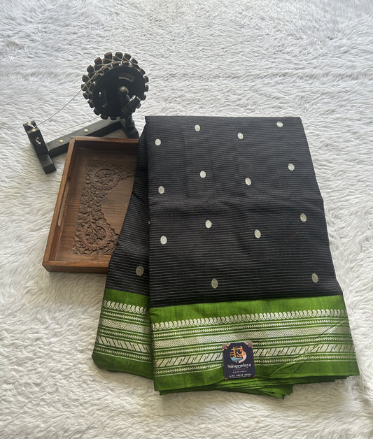 Gadwal Sico Saree Black colored complemented with a Light Green Zari Border.