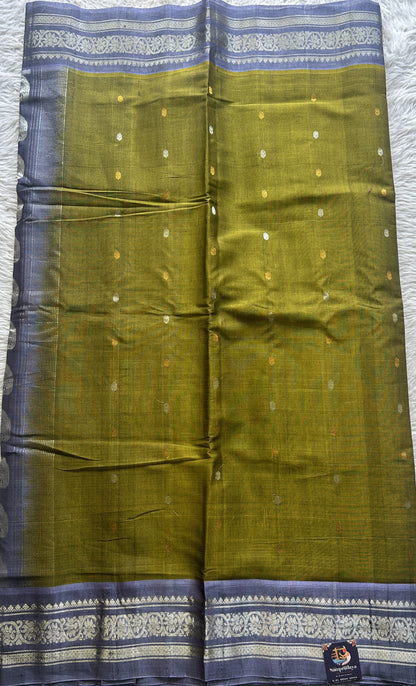 Gadwal Sico Saree Green colored complemented with a Lilac Zari Border.