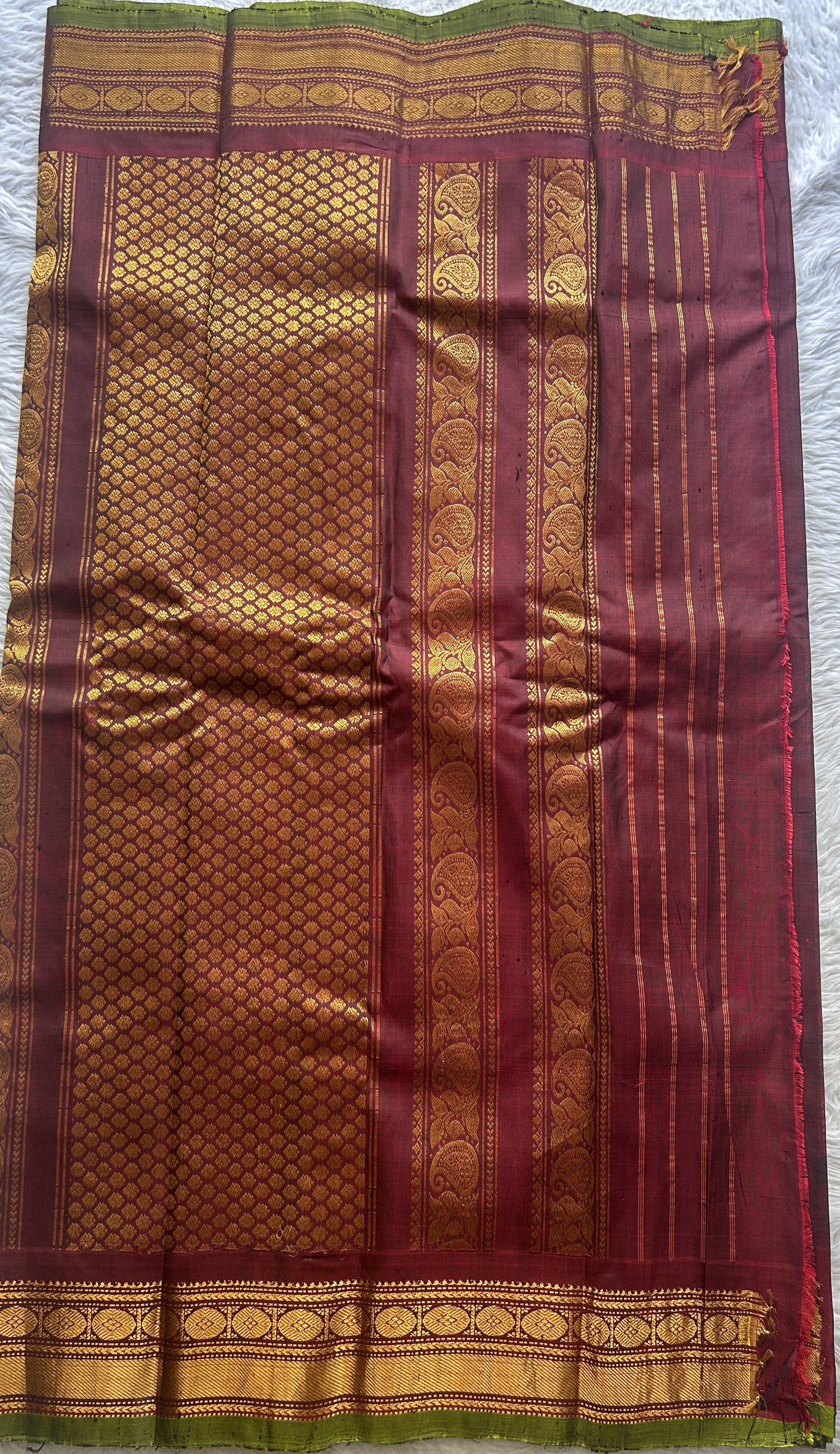 Gadwal Sico Saree Dark Green colored complemented with a Maroon Zari Border.