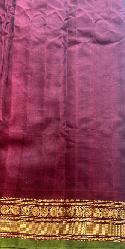 Gadwal Sico Saree Dark Green colored complemented with a Maroon Zari Border.