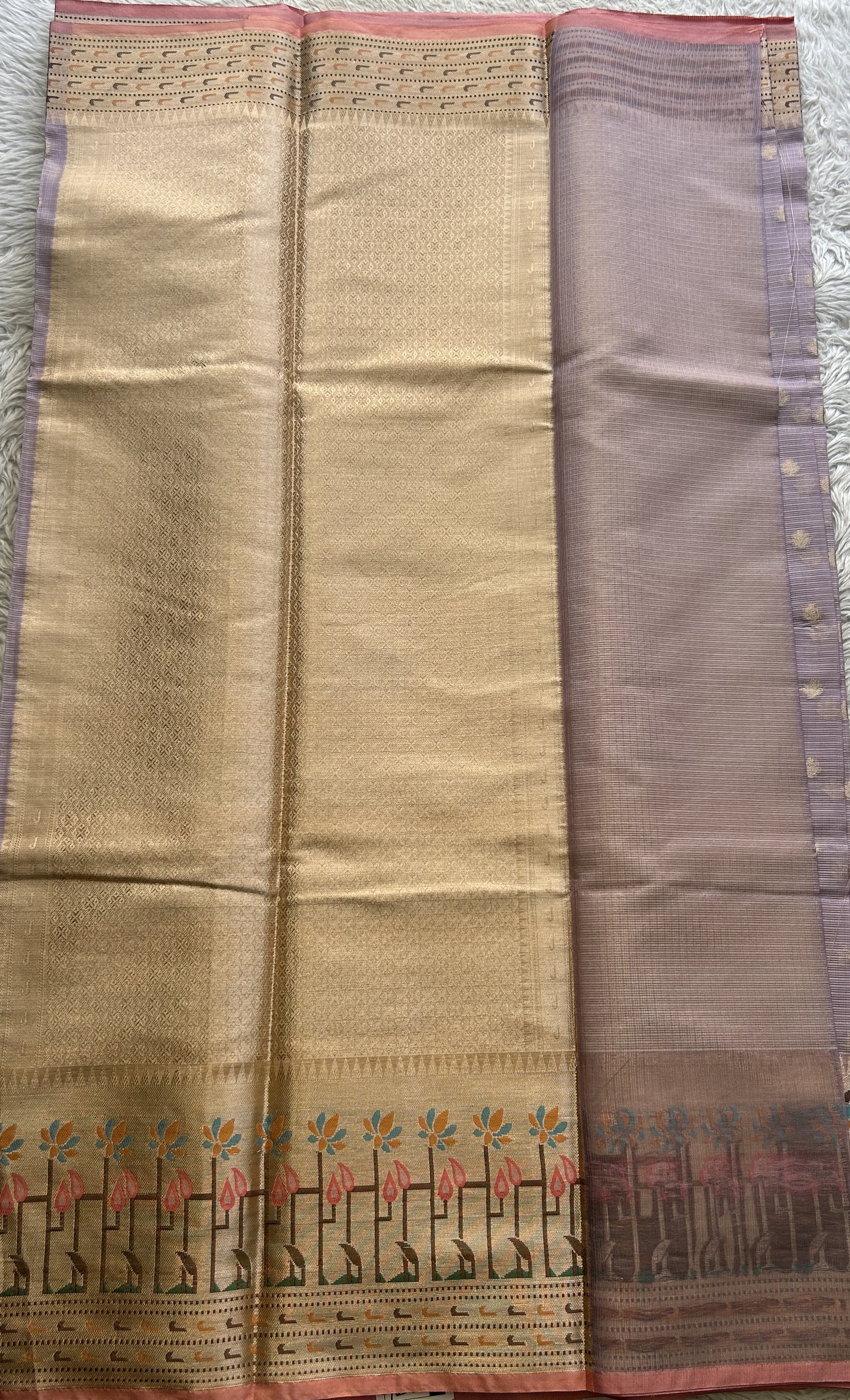 Silk kota Saree Lilac colored Complemented with a Zari Border.