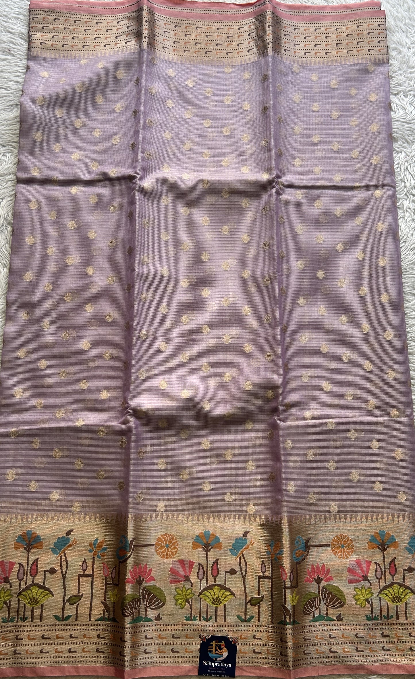 Silk kota Saree Lilac colored Complemented with a Zari Border.