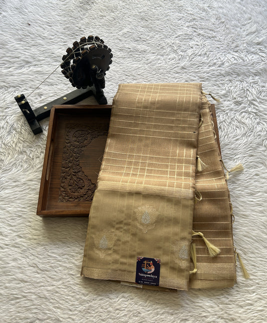 Tissue Silk kota Saree Gold colored Complemented with a Buti Border.