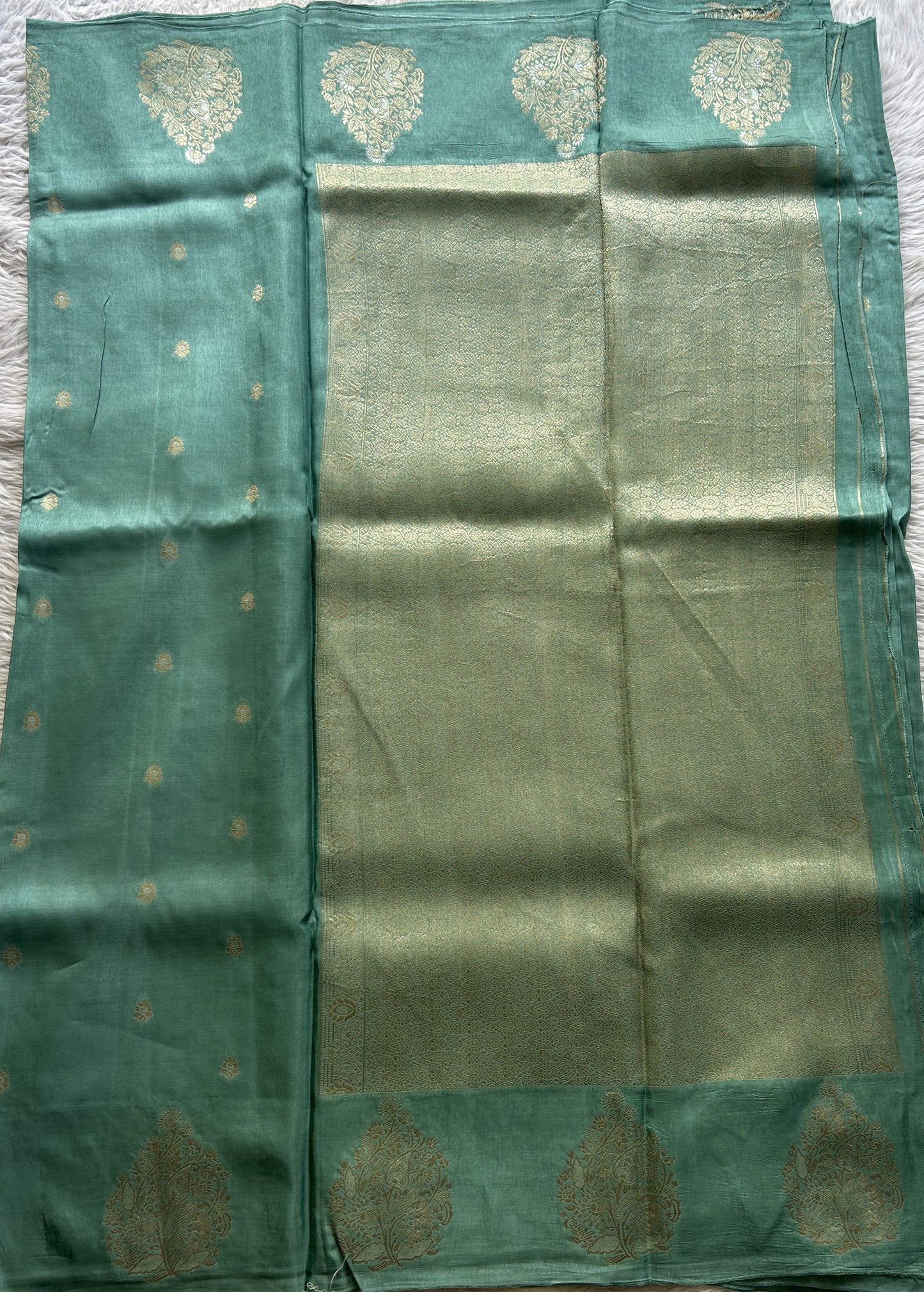 Mona Silk Saree Aqua Blue Colored Complemented with a Mashrur Border.