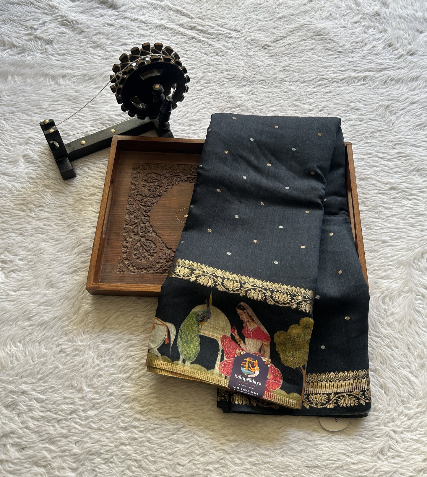 Pure Moonga Tussar Silk Saree Black Color Complemented with a Digital Print Border.