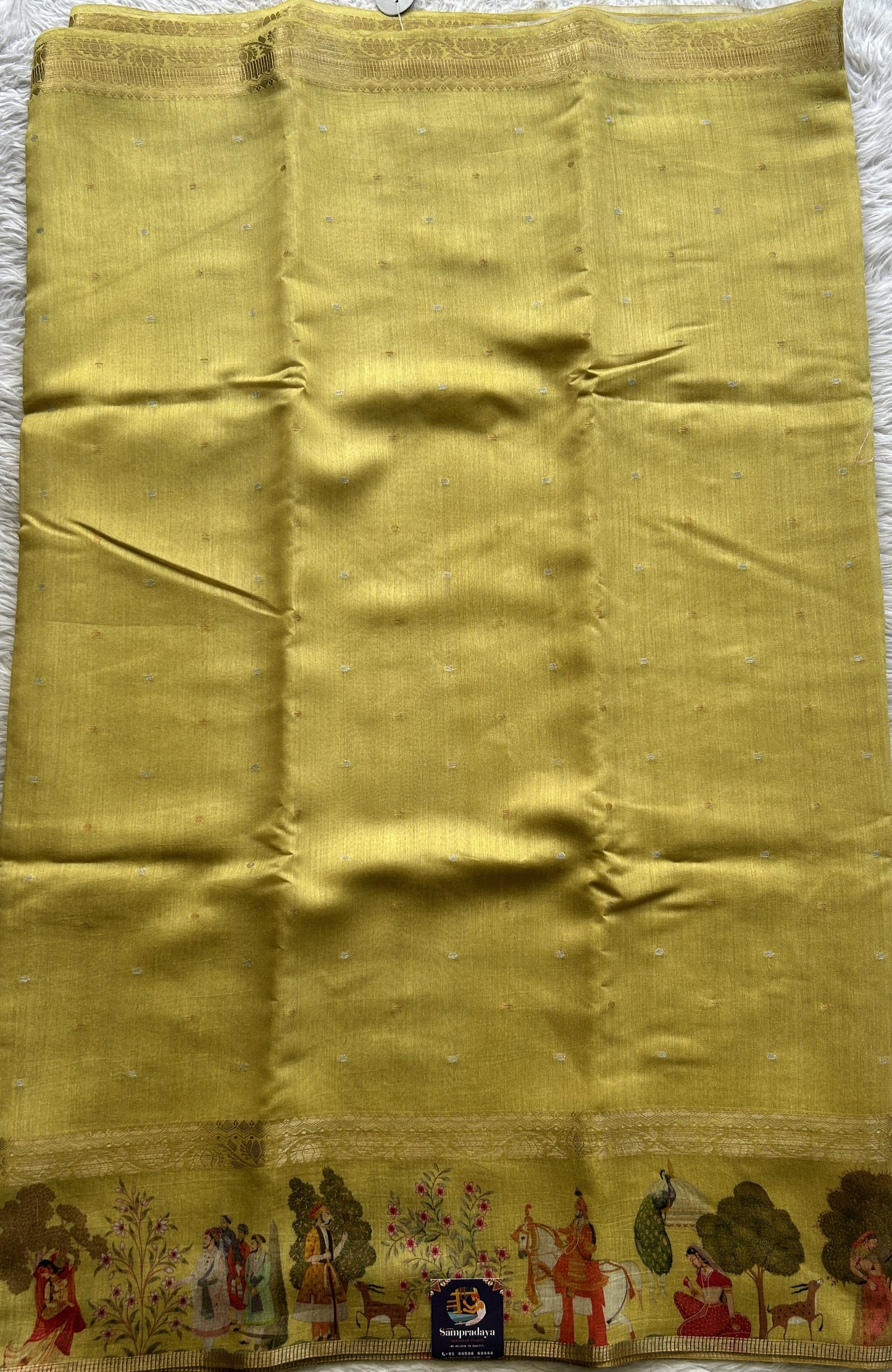 Pure Moonga Tussar Silk Saree Mustard Color Complemented with a Digital Print Border.