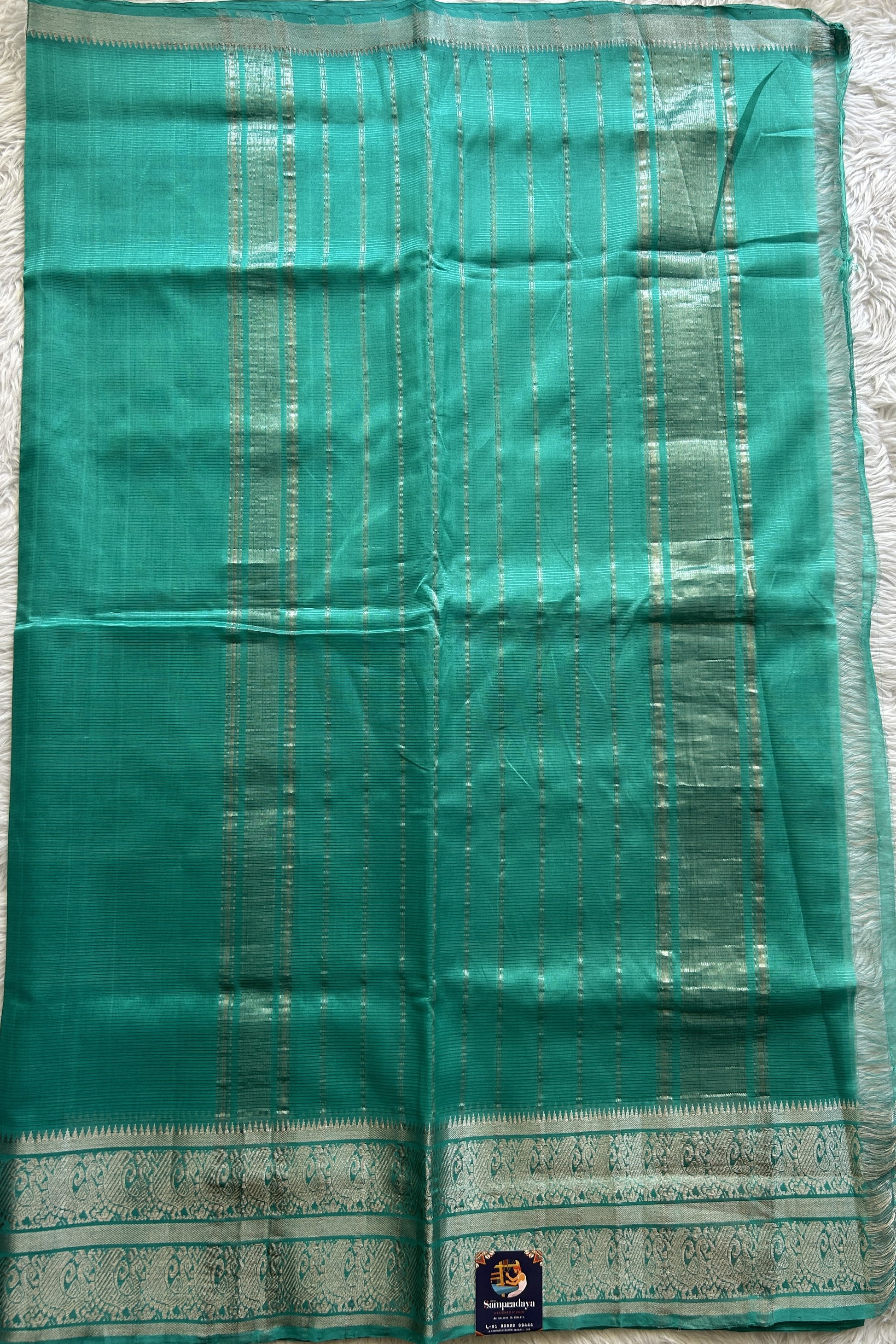 Mangalagiri Plain Pattu Saree Aqua Blue colored complemented with a Zari Border - Sampradaya Designer Studio